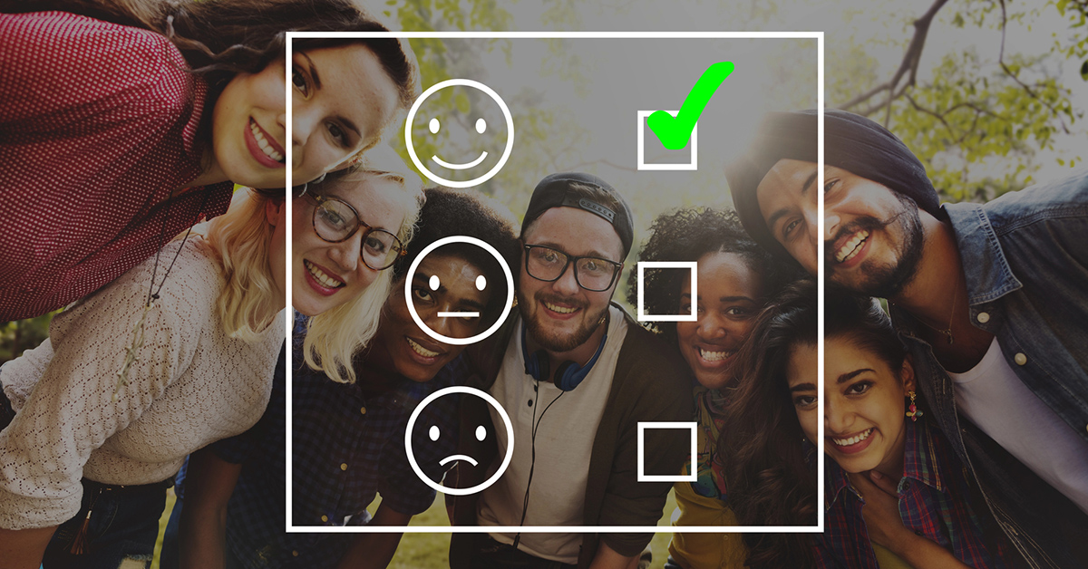 Concept shot of a group of happy employees with a feedback graphic transposed over the top of them.