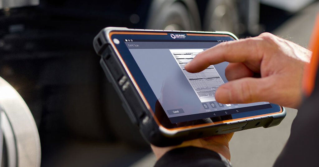 A truck driver using the ISAAC Scan feature on a rugged tablet to capture a document.