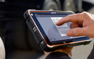 A truck driver using the ISAAC Scan feature on a rugged tablet to capture a document.